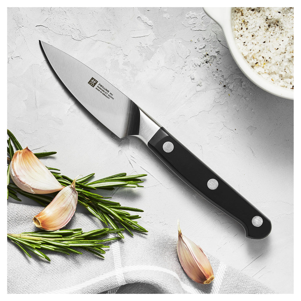 Couteau de chef ZWILLING Pro avec ail et romarin
