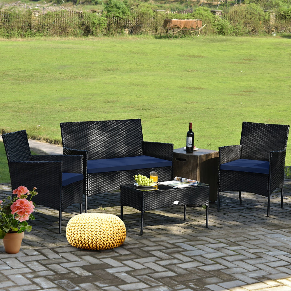 Ensemble de mobilier de patio 4 pièces en rotin – canapé avec coussins et table basse en verre trempé