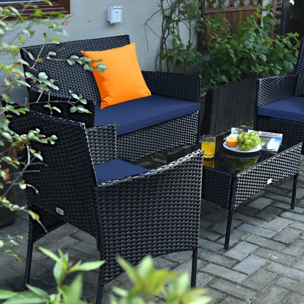 Ensemble de mobilier de patio 4 pièces en rotin – canapé avec coussins et table basse en verre trempé