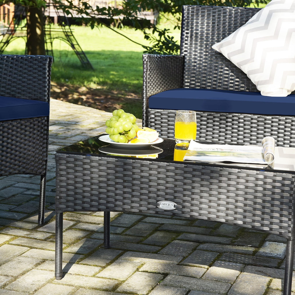 Ensemble de mobilier de patio 4 pièces en rotin – canapé avec coussins et table basse en verre trempé